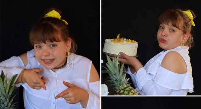 Une jeune fille qui sourie et qui a un gâteau dans les mains